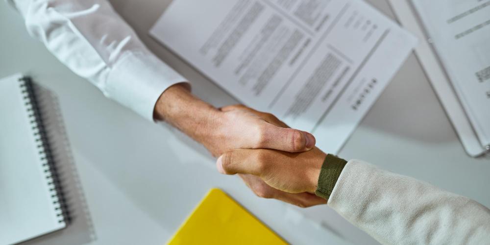 closeup-businessmen-shaking-hands-after-successful-agreement